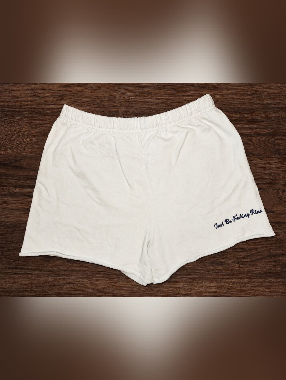 White Athletic Shorts with 'Just Be %@$&!+? Kind' Script